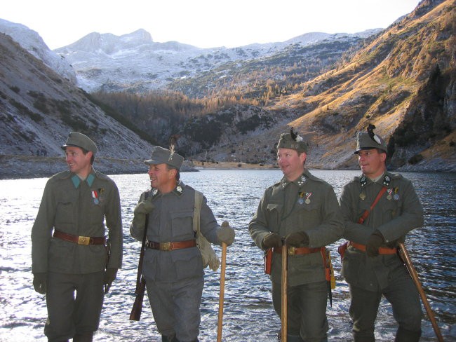 Soldiers, a lake and Mt Krn (Monte Nero) far behind