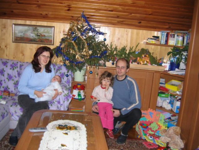 Family gathered at Christmas Tree