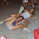 two chicks rolling on the floor all drunk :P